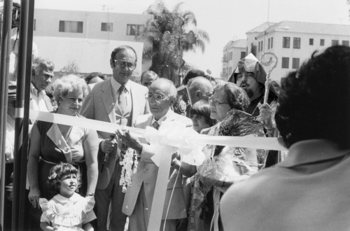 Photo of archbishop Vatche Hovespian, school founder Mr. Arshag Dickranian cutting the ribbon along with his wife Mrs. Eleanor Dickranian and school board chairman Mr. George Mandossian